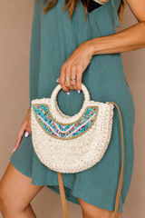 Petit sac en raphia tressé à perles turquoise